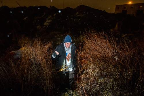 Chris Detrick  |  The Salt Lake Tribune
Larry Mullin, of the Volunteers of America, searches for homeless people on the west side of Salt Lake City during the annual Point In Time Count of unsheltered homeless youths, adults and families required by the Department of Housing and Urban Development Saturday January 30, 2016.