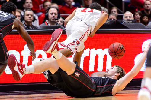 Trent Nelson  |  The Salt Lake Tribune
Utah Utes guard Brandon Taylor (11) goes after the ball, with Stanford Cardinal center Grant Verhoeven (30) on the floor as the University of Utah hosts Stanford, NCAA basketball at the Huntsman Center in Salt Lake City, Saturday January 30, 2016.