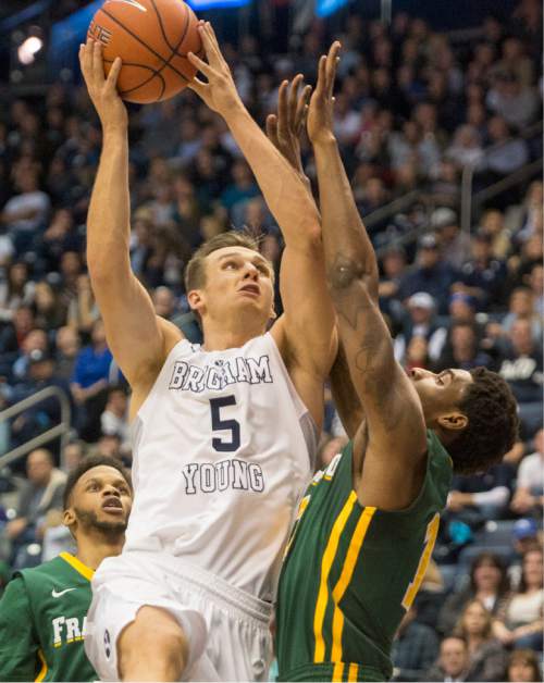 Rick Egan  |  The Salt Lake Tribune

Brigham Young Cougars guard Kyle Collinsworth (5) goes in for two points, in basketball action BYU vs. San Francisco, at the Marriott Center, Saturday, January 9, 2015.