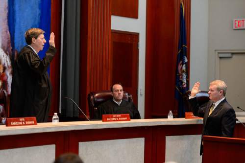 Trent Nelson  |  The Salt Lake Tribune
John A. Pearce, right, is sworn in by Chief Justice Matthew B. Durrant at his Investiture Ceremony as a justice for the Utah Supreme Court, in Salt Lake City, Friday January 29, 2016.