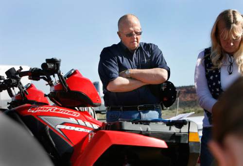 Scott Sommerdorf  |  The Salt Lake Tribune

Rep. Mike Noel, R-Kanab, prays with Shawna Cox at the beginning of an ATV protest ride in Paria Canyon in 2009.