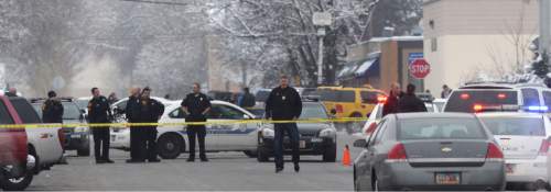 Steve Griffin  |  The Salt Lake Tribune


Salt Lake City Police officers at the scene of an officer involved shooting near 1300 south and Major Street (50 south) in Salt Lake City, Sunday, January 31, 2016.