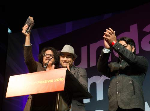 Rick Egan  |  The Salt Lake Tribune

Manolo Cruz, Carlos del Castillo receive the Audience Award for the film "Between Sea and Land" at the Sundance Film Festival Awards Ceremony in Park City, Saturday, January 30, 2016.