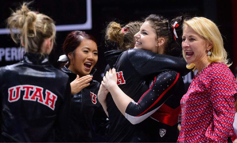 Trent Nelson  |  The Salt Lake Tribune
Utah's Samantha Partyka celebrates with teammates after her floor routine as the University of Utah hosts Arizona, NCAA gymnastics at the Huntsman Center in Salt Lake City, Monday February 1, 2016. Coach Megan Marsden at right.