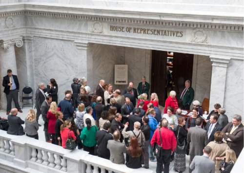 Rick Egan  |  The Salt Lake Tribune
Lobbyists wait outside the doors of the Utah House of Representatives on Friday. Registered lobbyists outnumber lawmakers by a four-to-one margin.