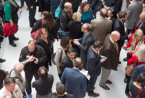 Rick Egan  |  The Salt Lake Tribune

Lobbyists wait outside the doors of the Utah House of Representatives. Registered lobbyists outnumber lawmakers by a four-to-one margin. Friday, February 5, 2016.
