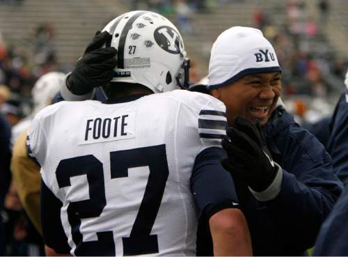 Trent Nelson  |  The Salt Lake Tribune
Mark Atuaia celebrates with BYU running back David Foote (27) after his fourth quarter touchdown, BYU vs. Colorado State, college football, Saturday, November 13, 2010. BYU won 49-10.