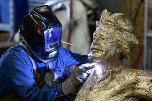 Francisco Kjolseth | The Salt Lake Tribune
Humberto Morales works on Einstein as he puts the final touches on the sculpture created by Gary Lee Price at his Springville studio.