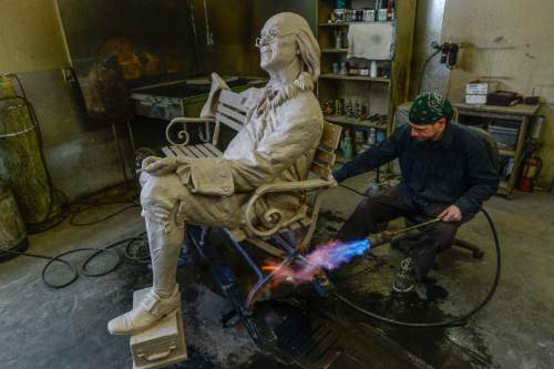 Francisco Kjolseth | The Salt Lake Tribune
Jeff Caron adds the final patina to a Benjamin Franklin at sculptor Gary Lee Price's studio in Springville.