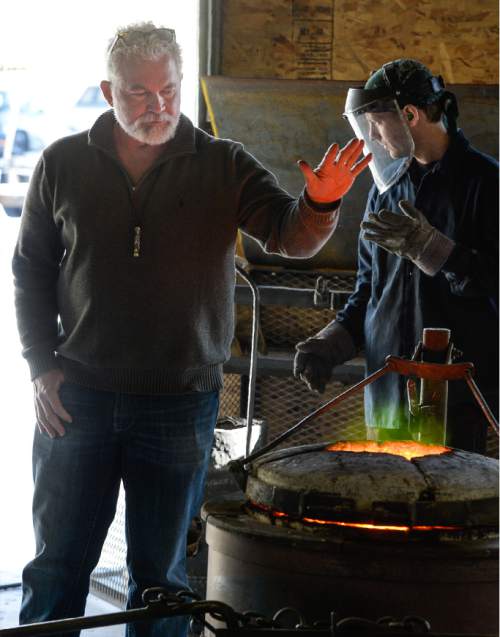 Francisco Kjolseth | The Salt Lake Tribune
Art gets ready to flow from molten bronze as noted sculptor Gary Lee Price, left, warms himself at his Springville studio prior to a pour of pieces that will become part of his Great Contributors exhibit. Eight life-size bronze statues will be part of this year's Dallas Blooms 2016 at the Dallas Arboretum and Botanical Garden. The statues (Mark Twain, Abraham Lincoln, Benjamin Franklin, George Washington, Claude Monet, Albert Einstein, William Shakespeare and the Wright Brothers) will be seated throughout the 66-acre garden from Feb. 27 to April 10.
