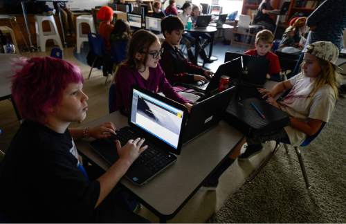 Francisco Kjolseth | The Salt Lake Tribune
At Open Classroom Charter school in the avenues, 6th and 7th graders design their own web sites as part of an elective class. A legislative task form is recommending changes to the way Utah's charter schools are funded.