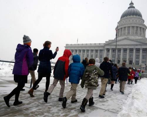 Al Hartmann  |  The Salt Lake Tribune
Students from the Madeleine Choir School were among those who marched up State Street to the Capitol to meet in the rotunda for a rally for clean air Thursday, Feb. 4.