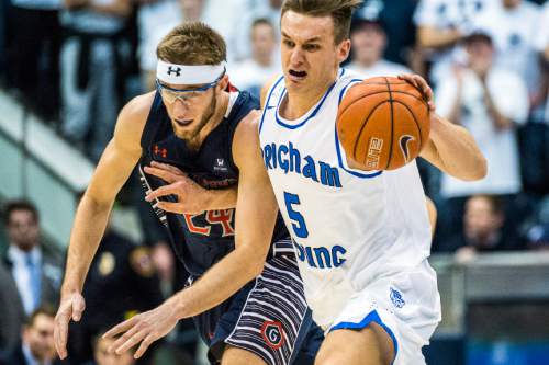 Chris Detrick  |  The Salt Lake Tribune
Brigham Young Cougars guard Kyle Collinsworth (5) runs past St. Mary's Gaels forward Calvin Hermanson (24) during the game at the Marriott Center Thursday February 4, 2016. Brigham Young Cougars defeated St. Mary's Gaels 70-59.