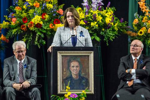 Chris Detrick  |  The Salt Lake Tribune
Erika Barney speaks during the funeral her husband Officer Douglas Scott Barney at the Maverik Center Monday January 25, 2016. Barney was shot Jan. 17 in a confrontation with Cory Lee Henderson, a fugitive parolee who was fleeing the scene of a traffic accident in Holladay. Henderson later was killed in a shootout with officers, according to police.