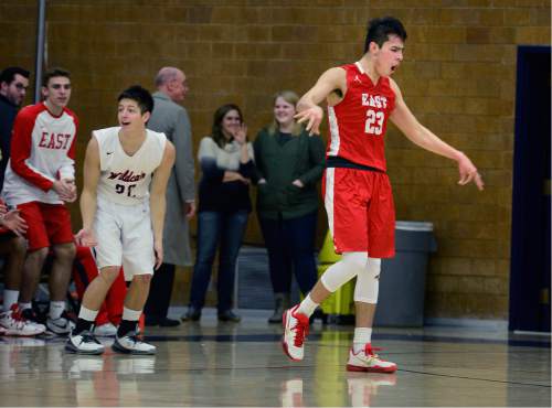 Scott Sommerdorf   |  The Salt Lake Tribune
East's Dacian Spotted Elk freacts after he made a three-point shot and was fouled by Woods Cross' Sam Pugsley, at left. Spotted Elk made the free throw for a four-point play. Woods Cross beat East 65-56, Friday, February 5, 2016.