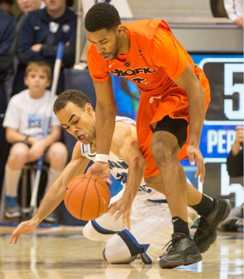 Rick Egan  |  The Salt Lake Tribune

Brigham Young Cougars guard Jordan Chatman (25) goes after the ball along with Pacific Tigers guard T.J. Wallace (2), in WCC basketball action, Brigham Young Cougars vs. The Pacific Tigers, Saturday, February 6, 2016.
