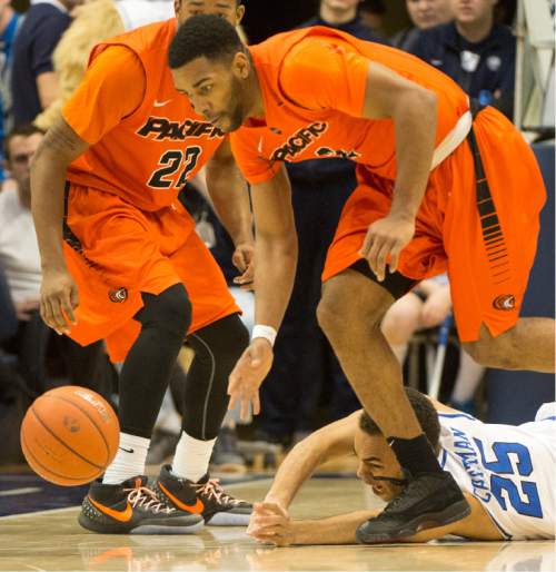 Rick Egan  |  The Salt Lake Tribune

Brigham Young Cougars guard Jordan Chatman (25) watches Pacific Tigers guard T.J. Wallace (2) pick up a loose ball, in WCC basketball action, Brigham Young Cougars vs. The Pacific Tigers, Saturday, February 6, 2016.