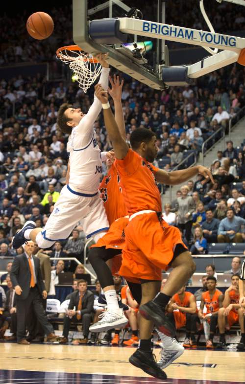 Rick Egan  |  The Salt Lake Tribune

Brigham Young Cougars guard Nick Emery (4) misses a lay-up, as Pacific Tiger defenders block his shot, in WCC basketball action, Brigham Young Cougars vs. The Pacific Tigers, Saturday, February 6, 2016.