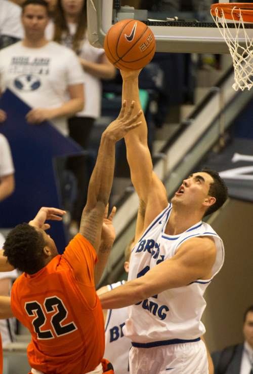 Rick Egan  |  The Salt Lake Tribune

Brigham Young Cougars center Corbin Kaufusi (44) blocks a shot by Pacific Tigers guard Ray Bowles (22) in WCC basketball action, Brigham Young Cougars vs. The Pacific Tigers, Saturday, February 6, 2016.