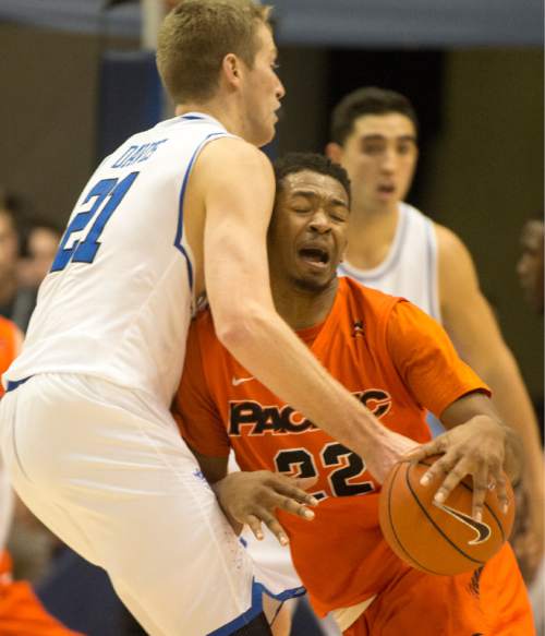 Rick Egan  |  The Salt Lake Tribune

Pacific Tigers guard Ray Bowles (22) runs into Brigham Young Cougars forward Kyle Davis (21), in WCC basketball action, Brigham Young Cougars vs. The Pacific Tigers, Saturday, February 6, 2016.
