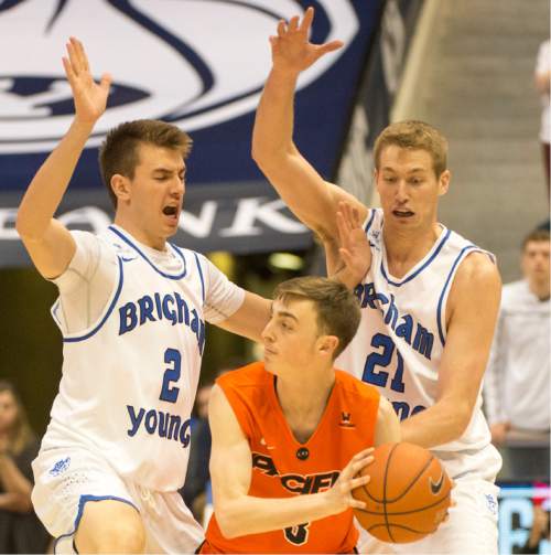 Rick Egan  |  The Salt Lake Tribune

Brigham Young Cougars guard Zac Seljaas (2) and Brigham Young Cougars forward Kyle Davis (21) put pressure on Pacific Tigers guard Alec Kobre (3), in WCC basketball action, Brigham Young Cougars vs. The Pacific Tigers, Saturday, February 6, 2016.