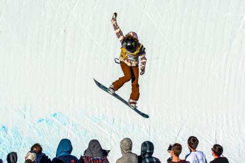 Chris Detrick  |  The Salt Lake Tribune
Chloe Kim, 15, competes on the Eagle Superpipe during the halfpipe snowboard finals of the 2016 U.S. Freeskiing Grand Prix at Park City Mountain Resort Saturday February 6, 2016. Kim made history by being the first woman to land back-to-back 1080's during a competition, scoring a perfect 100 and winning the event.