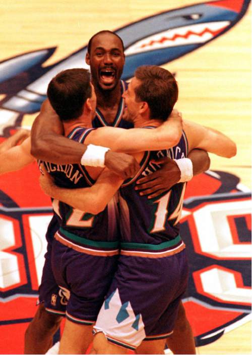 | Tribune File Photo

Utah Jazz John Stockton(L) get a hugged from teammates  Karl Malone(C) and Jeff Hornacek (R) in the final shot of the game, to win in Houston, and the Western Conference Finals Championship title. The Jazz defeated the Rockets 103-100, May 29th,to win the series and will play Chicago Bulls in the NBA Finals.