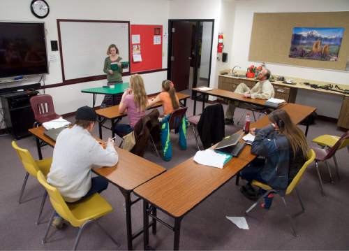 Lynn R. Johnson  |  Special to the Tribune

Five students -- almost half of the school's student body -- participate in a family conservation science class at West Desert High School in Trout Creek, Utah.  Scott Anderson, seated at right, is the school's sole teacher and basketball coach.