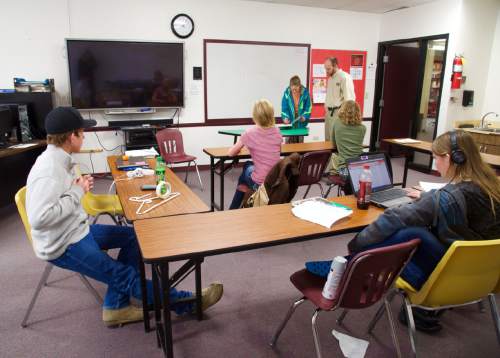Lynn R. Johnson  |  Special to the Tribune

Scott Anderson, standing, far right, is the only teacher at West Desert High School on the western edge of Juab County.  Anderson, seen here teaching a family conservation science class, also serves as the school basketball coach.