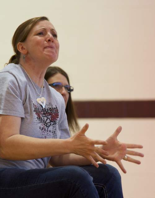 Lynn R. Johnson  |  Special to the Tribune

Molly Reil shows emotion during Wednesday's basketball game between West Desert High School and Salt Lake's Merit Academy.  Molly's son John is a member of the team.