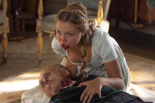 This image released by Screen Gems shows Jess Radomska in a scene from "Pride and Prejudice and Zombies." (Jay Maidment/Screen Gems, Sony via AP)