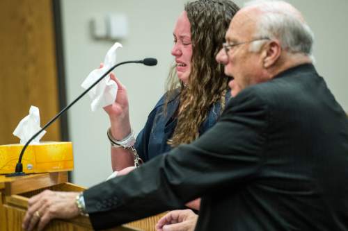 Chris Detrick  |  The Salt Lake Tribune
Meagan Grunwald reacts as  her attorney, Dean Zabriskie, speaks during her sentencing at 4th District Court in Provo Wednesday July 8, 2015.  Eighteen-year-old Meagan Grunwald was sentenced Wednesday to 25 years to life in prison for being an accomplice to the murder last year of Utah County Sheriff's Sgt. Cory Wride and the attempted murder of Deputy Greg Sherwood.