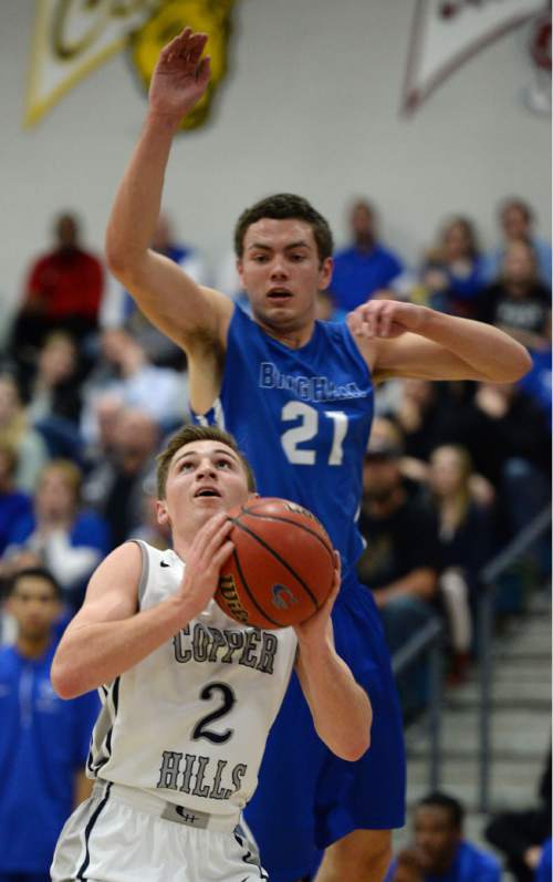 Steve Griffin  |  The Salt Lake Tribune


Copper Hills guard Trevor Hoffman holds the ball as Bingham's Schyler Shoemaker looks to block his shot as the Grizzlies host No. 1 Bingham in a pivotal Region 3 boys' basketball game at Copper Hills High School in West Jordan, Tuesday, February 9, 2016.