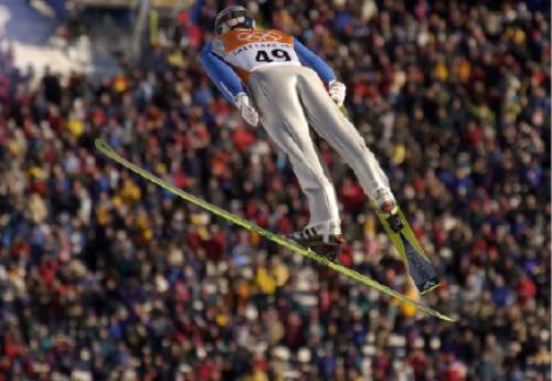 Trent Nelson  |  Tribune file photo
U.S. ski jumper Alan Alborn soars over the crowd for a distance of 119.5 meters. Qualification round of the K120 Ski Jump at the Utah Olympic Park, 2002 Olympic Winter Games.