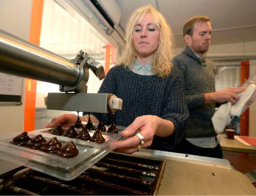 Al Hartmann  |  The Salt Lake Tribune
Robbie Stout and Anna Davies, owners of Ritual Chocolate in Park City, mold bars on a tempering machine, the final step before packaging.  They recently earned honors in the 2016 Good Food Awards for their Mid Mountain chocolate bar.