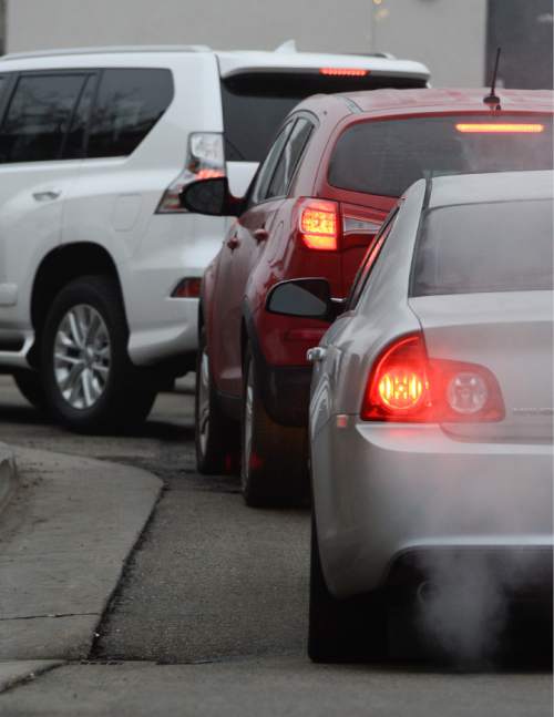 Francisco Kjolseth | The Salt Lake Tribune
A sizable source of emissions come from idling tailpipes as drivers line up for their morning coffee. People  "warming up" their cars, a widespread practice in Utah is also a problem. Last month Salt Lake City police found 600 unattended, idling vehicles in the space of three hours, but it's completely unnecessary. For modern cars, all idling does is release a lot of emissions.