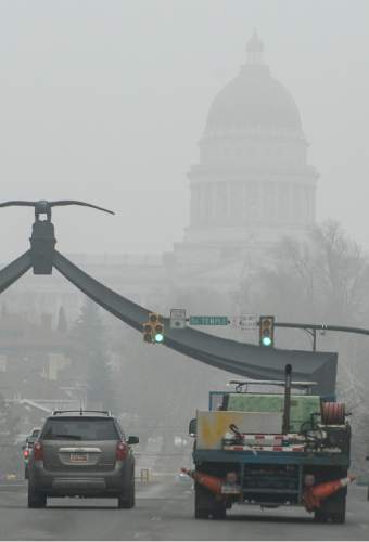 Francisco Kjolseth | The Salt Lake Tribune
Pool air quality blankets the valley, obscuring visibility and increasing health concerns. A sizable source of emissions, comes from "warming up" your car, a widespread practice in Utah.Last month Salt Lake City police found 600 unattended, idling vehicles in the space of three hours, even though it's completely unnecessary. For modern cars, all idling does is release a lot of emissions.