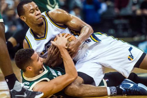 Chris Detrick  |  The Salt Lake Tribune
Utah Jazz guard Rodney Hood (5) and Milwaukee Bucks guard Michael Carter-Williams (5) fight for the ball during the game at Vivint Smart Home Arena Friday February 5, 2016.