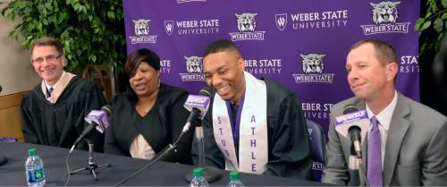 Al Hartmann  |  The Salt Lake Tribune
Damian Lillard, point guard for the Portland Trail Blazers, center, answers questions at a press conference at the Dee Events Center  before he received his diploma at Weber State commencement ceremony.   Left is his academic advisor Carl Grunander and his mother Gina Johnson.   Weber basketball coach Randy Rahe, right.    Lillard is graduating with a degree in professional sales. He  was six credits shy of graduating when he was drafted in 2012, but polished off his classes in the offseason.