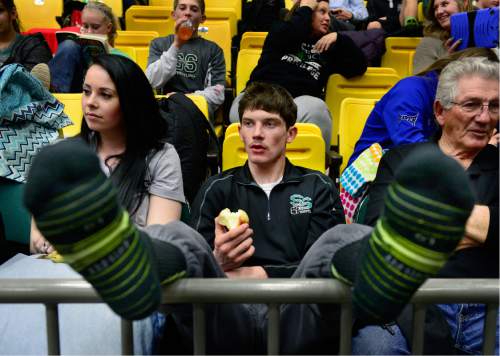 Scott Sommerdorf   |  The Salt Lake Tribune
After winning his way into tomorrow's semi-final matches, South Summit wrestler Matt Lee (126 lbs) relaxes with an apple and watches the action during the state wrestling tournament at UVU, Friday, February 12, 2016.