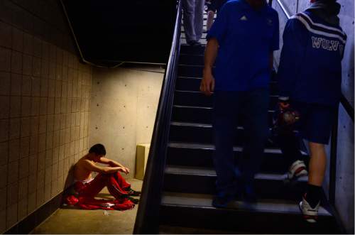 Scott Sommerdorf   |  The Salt Lake Tribune
A wrestler is alone with his thoughts after seeking a secluded spot to concentrate between matches during the state wrestling tournament at UVU, Friday, February 12, 2016.