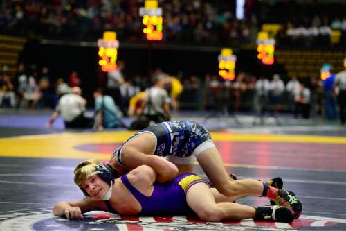 Scott Sommerdorf   |  The Salt Lake Tribune
Panguitch wrestler Colton Owens is struggling to avoid being pinned during his 126 lb. match that he eventually lost during the state wrestling tournament at UVU, Friday, February 12, 2016.