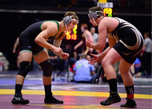 Scott Sommerdorf   |  The Salt Lake Tribune
James Skow of South Summit, left, and Ty Meacham of Emery, compete in the 220 lb 2A match during the state wrestling tournament at UVU, Friday, February 12, 2016. Meacham pulled off a come-from-behind win after the match had to be delayed to deal with his bloodied nose.