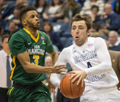 Rick Egan  |  The Salt Lake Tribune

Brigham Young Cougars guard Nick Emery (4) gets past San Francisco Dons guard Ronnie Boyce III (3) in basketball action BYU vs. San Francisco, at the Marriott Center, Saturday, January 9, 2015.