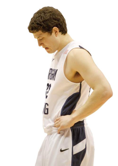 Rick Egan  |  The Salt Lake Tribune

BYU guard Jimmer Fredette (32) hangs his head late in the second half, as the Cougars fall further and further behind,  in Mountain West Basketball action, BYU vs New Mexico in the Marriott Center in Provo, Wednesday, March 2, 2011.