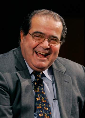 FILE - In this Wednesday, Jan. 10, 2007 file photo, Supreme Court Justice Antonin Scalia smiles during his introduction at the Intercontinental Hotel in Cleveland, as part of a Cleveland Clinic speakers series. On Saturday, Feb. 13, 2016, the U.S. Marshals Service confirmed that Scalia has died at the age of 79. (AP Photo/Mark Duncan)