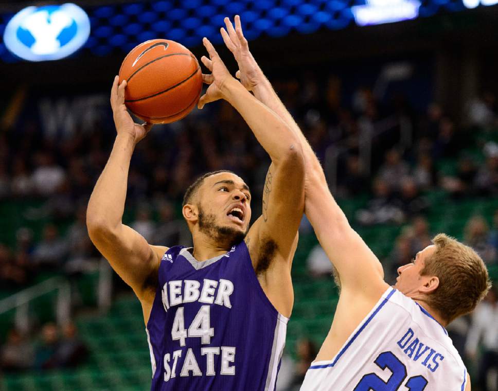 Trent Nelson  |  The Salt Lake Tribune
Weber State's Zach Braxton shoots over BYU's Kyle Davis as BYU faces Weber State, NCAA basketball at Vivant Smart Home Arena in Salt Lake City, Saturday December 5, 2015.