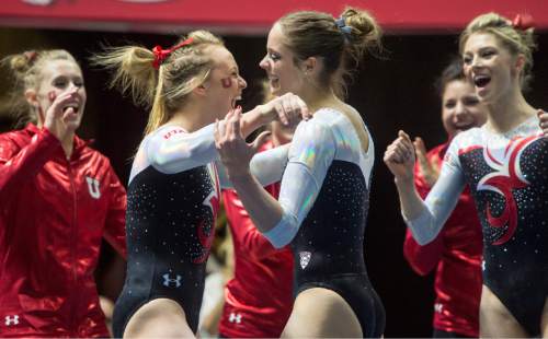 Rick Egan  |  The Salt Lake Tribune

Team mates congratulate Breanna Hughes after she competed on the floor for the Utes, in Gymnastics action, Utah vs. Washington, Saturday, February 13, 2016.