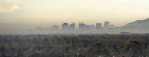 Al Hartmann  |  The Salt Lake Tribune
Salt Lake City skyline begins to emerge from fog Monday morning Feb. 15 as seen from Wasatch Blvd and 5500 S.