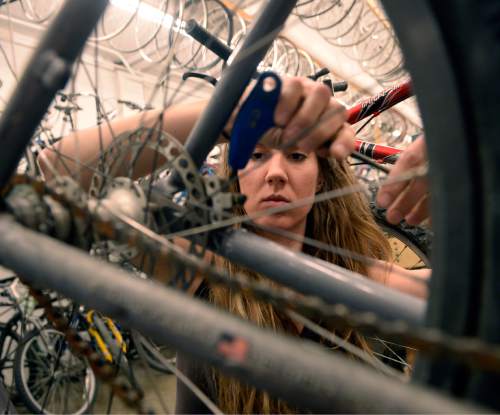 Al Hartmann  |  The Salt Lake Tribune
Volunteer Rachel Hinze works on reconditioning a donated bike during Women's Only night at Salt Lake Bicycle Collective.  Women's Only night runs from 5:30 -9:00 pm on Wednesday nights where women can work on their own projects or recondition used bicycles.   The Salt Lake Bicycle Collective is at 2312 S. West Temple. The collective's mission is to promote cycling as sustainable transportation.  It provides refurbished bicycles for the community, especially for children and lower income households.